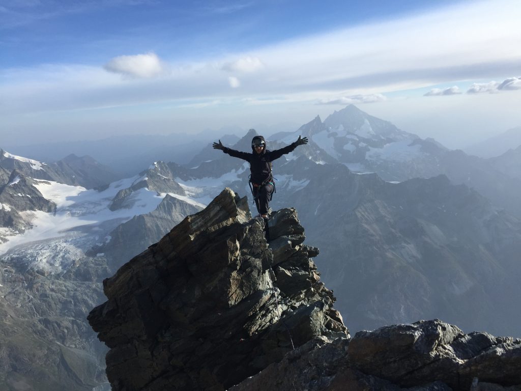 climber-on-summit-of-iconic-mountain-matterhorn-in-switzerland-europe